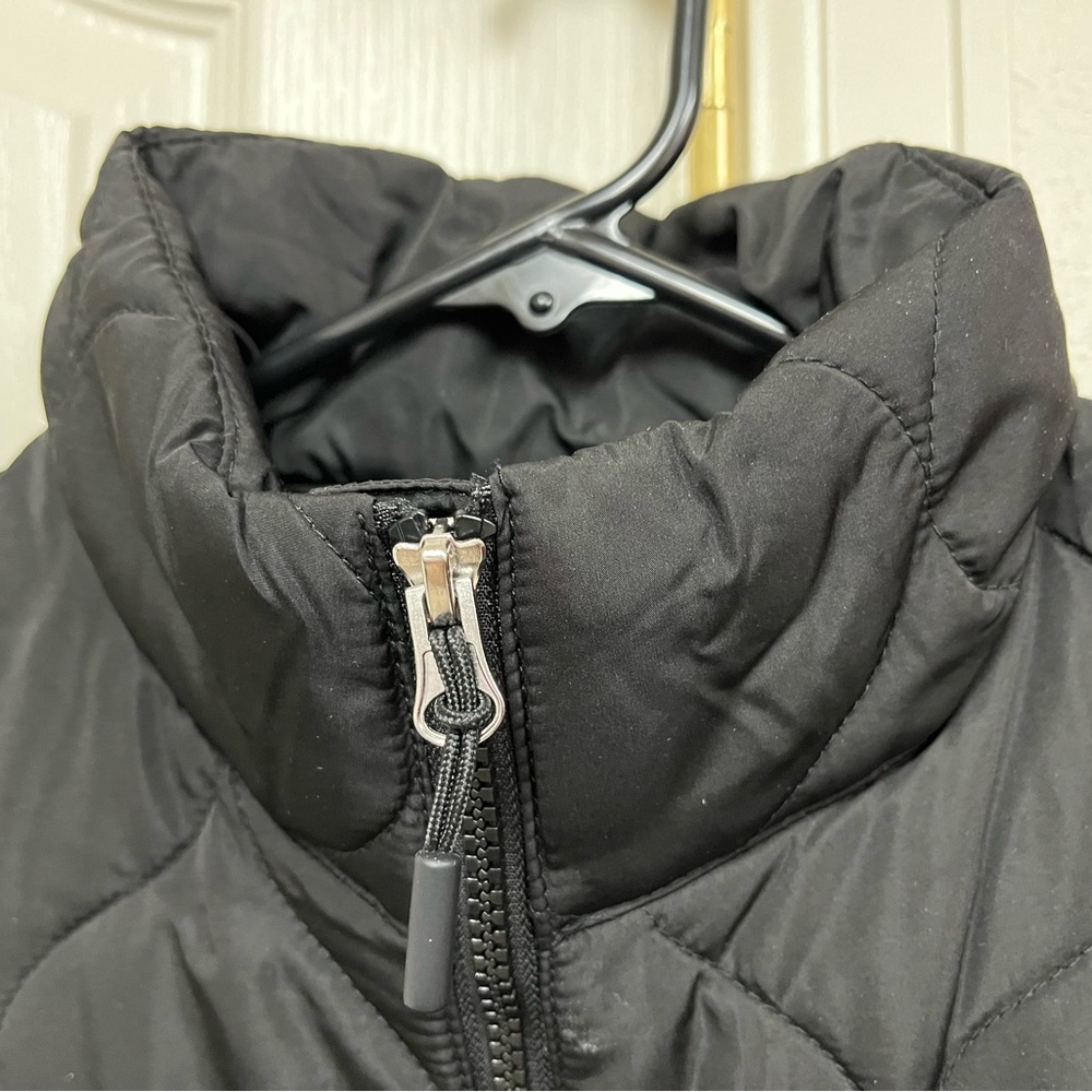 Quilted vest - brand new in sealed package.